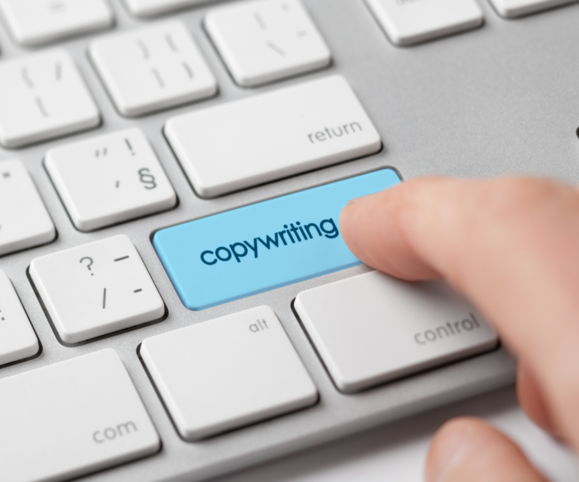 Finger Pressing Enter Key labeled "Copywriting"