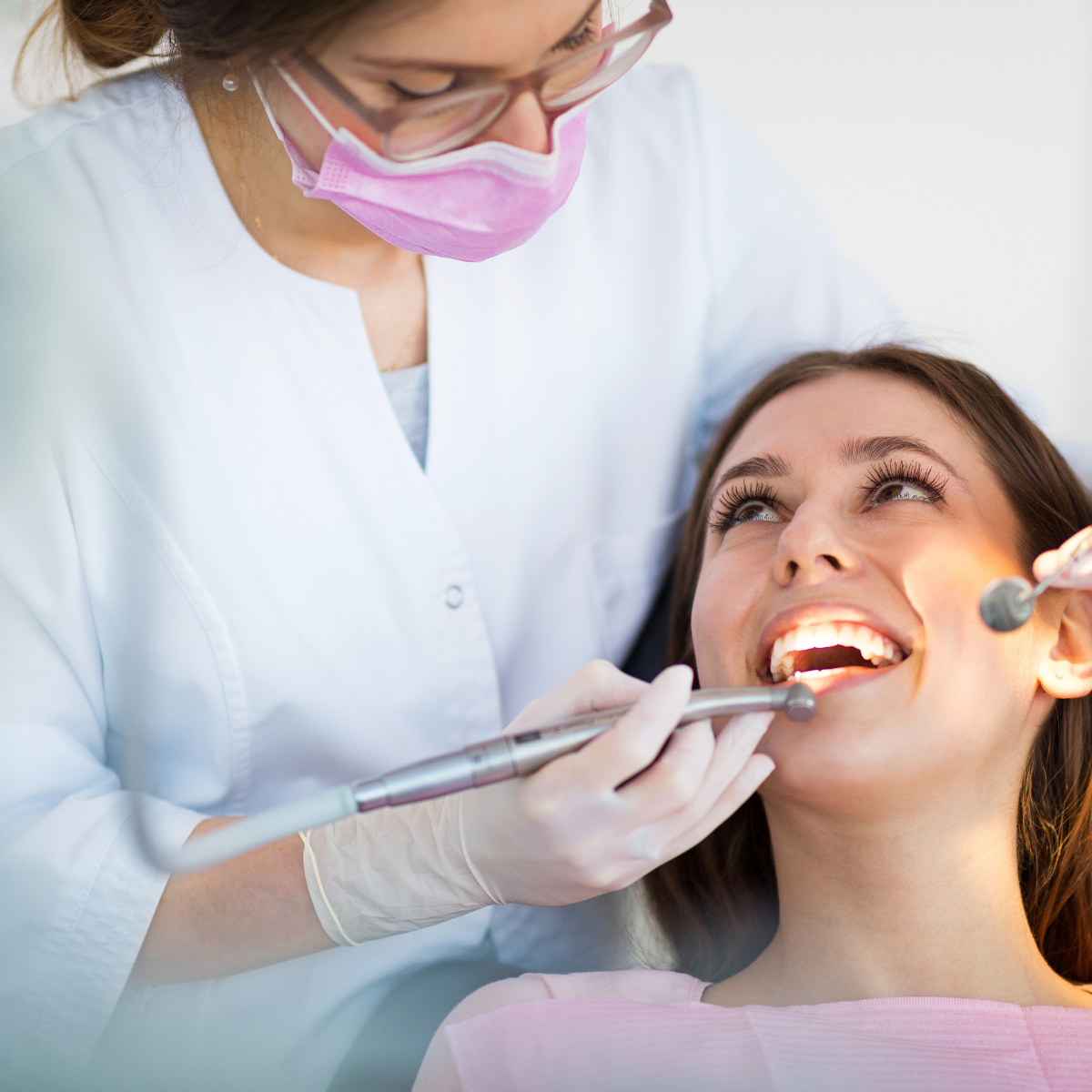 Dental Hygienist checking the teeth of a patient